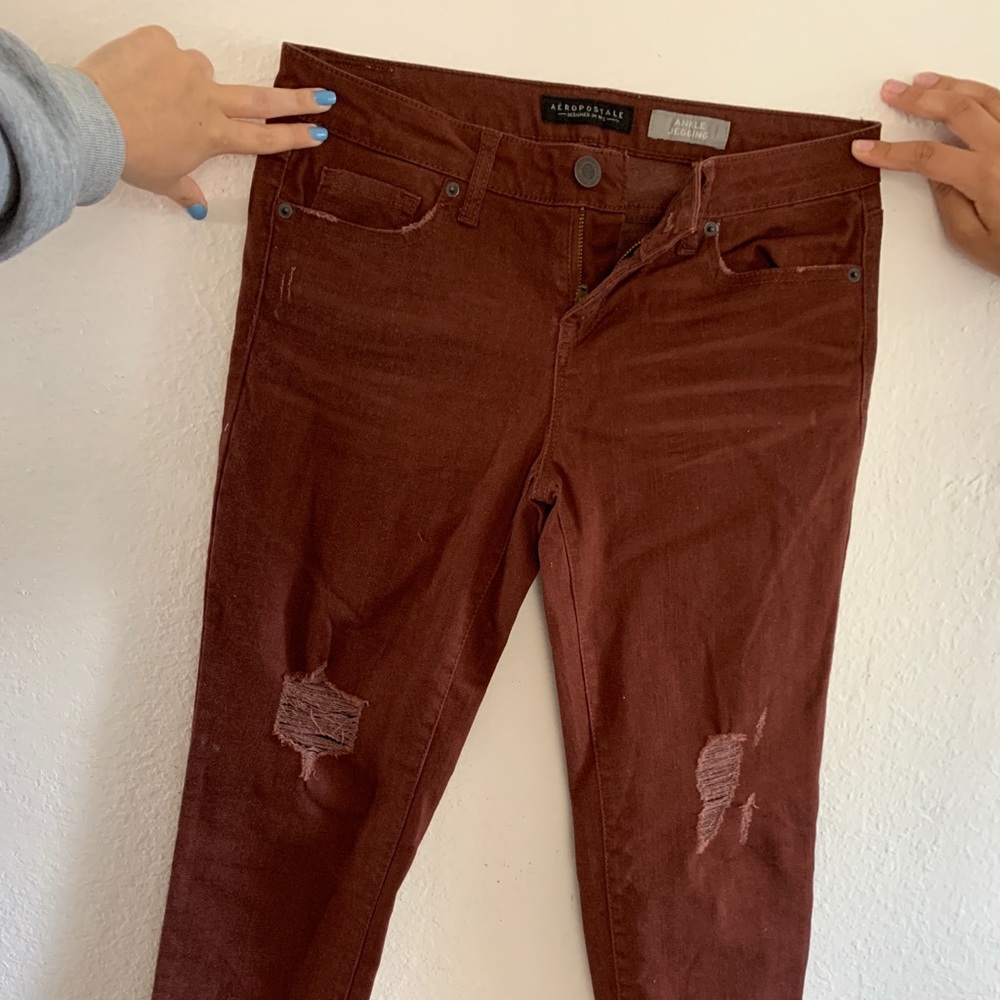 Maroon-ish Skinny ripped jeans